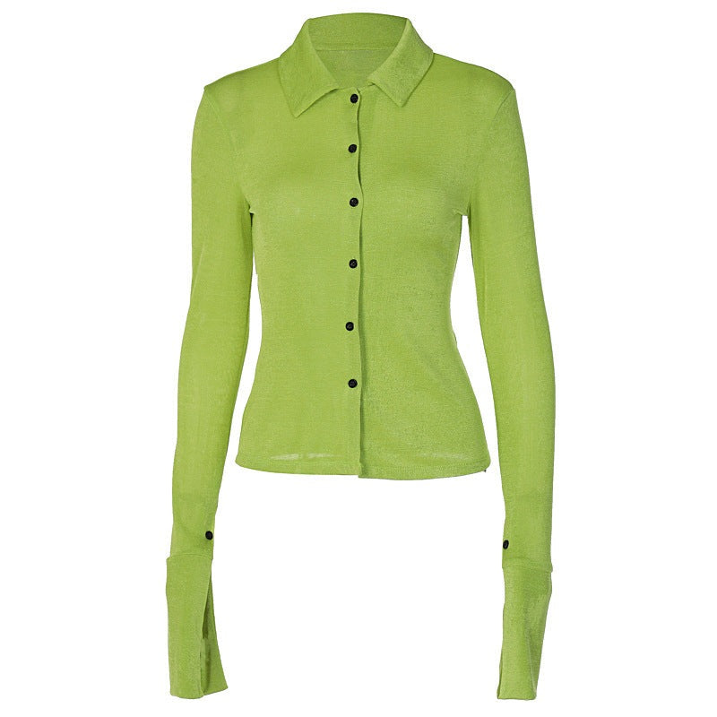 A polyester shirt in shades of black, green and white with long sleeves. It comes in 3 sizes S, M and L.