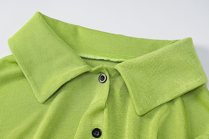 A polyester shirt in shades of black, green and white with long sleeves. It comes in 3 sizes S, M and L.