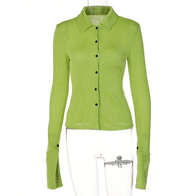 A polyester shirt in shades of black, green and white with long sleeves. It comes in 3 sizes S, M and L.