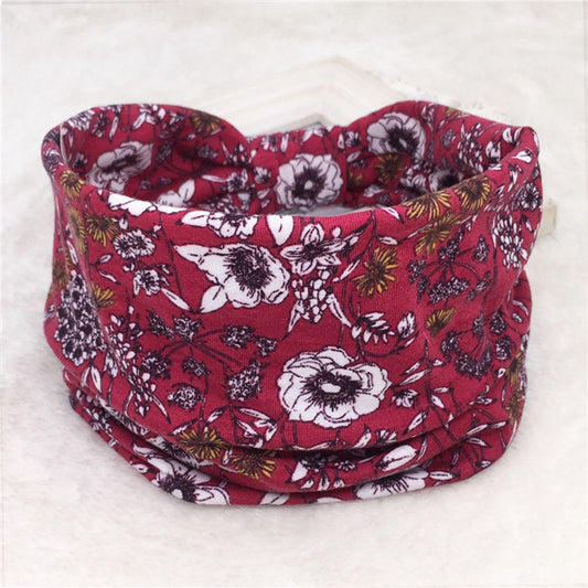 Introducing "Lady Nicola - The Nevermore Boho Bandana - Headband," a Bohemian-style accessory designed for women. This cloth headband, featuring geometric modeling and a distinctive printing series, comes in a variety of colors and prints, including floral patterns.