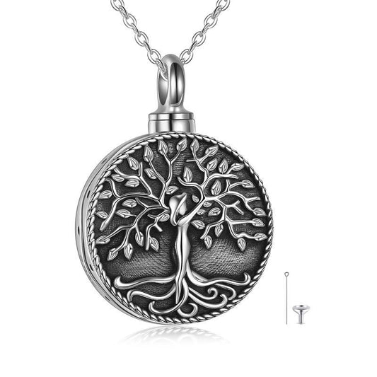 The Reidun Tree of Life - The Nevermore Pendant Necklace Urn is a beautiful and meaningful piece of jewelry that is made from high-quality 925 sterling silver. This pendant necklace features a unique design of the Tree of Life, which represents the cycle of life and death. The pendant also functions as an urn, allowing you to keep a small amount of ashes or a lock of hair of your loved one close to your heart.