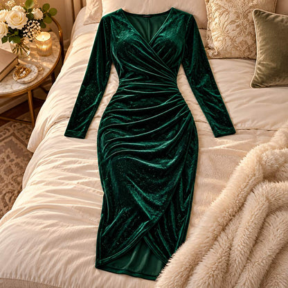 Amory green velvet midi dress arranged on a styled bed in an elegant bedroom.