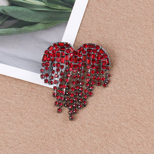Red heart brooch with artificial gemstone detailing