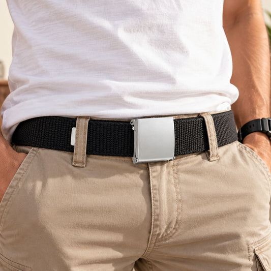 Black woven belt with silver buckle worn with beige trousers