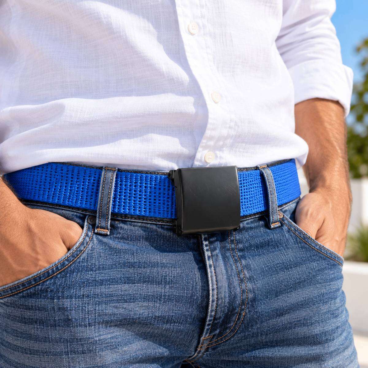 Blue woven belt with a black buckle, worn with a white shirt and blue jeans.