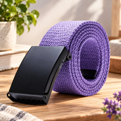 Purple woven belt arranged in a coil with its black buckle facing forward.