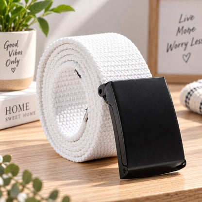 White woven belt arranged in a coil with its black buckle facing forward.