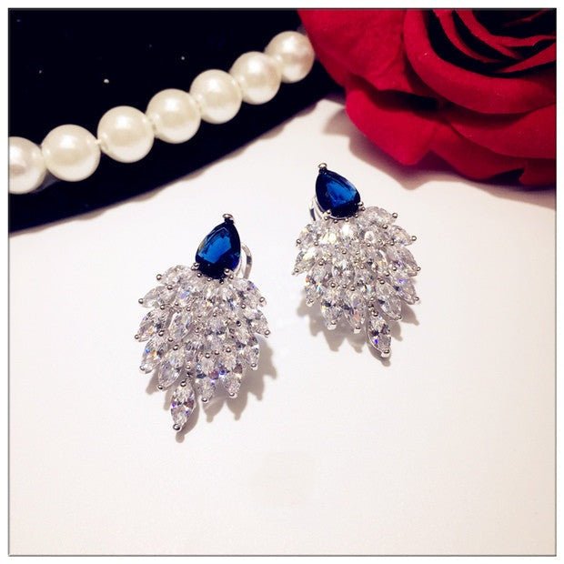 Tawny - The Nevermore Earrings for Woman Sapphire And Sterling Silver Earrings Wings – Unique Earrings by Nevermore Lifestyle & Tech |