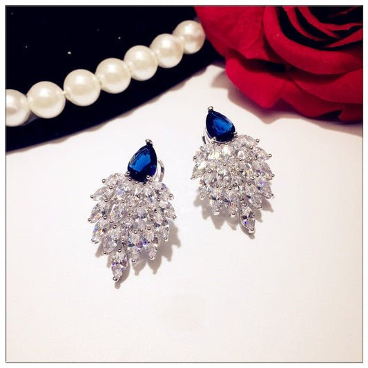 Tawny - The Nevermore Earrings for Woman Sapphire And Sterling Silver Earrings Wings – Unique Earrings by Nevermore Lifestyle & Tech |